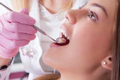 woman getting dental exam