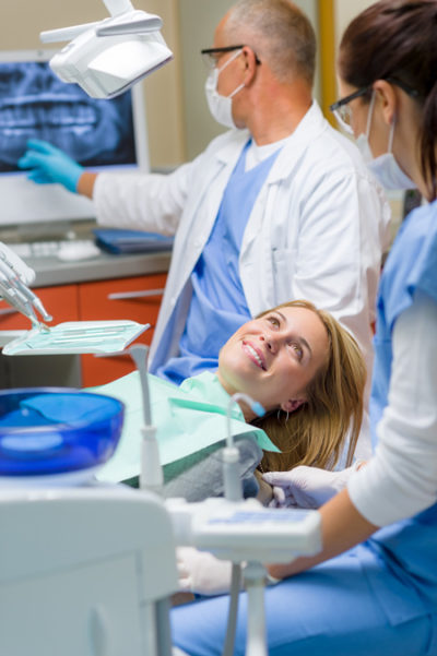 woman getting wisdom tooth extraction at her South Calgary dentist