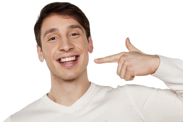man smiling after receiving dental services