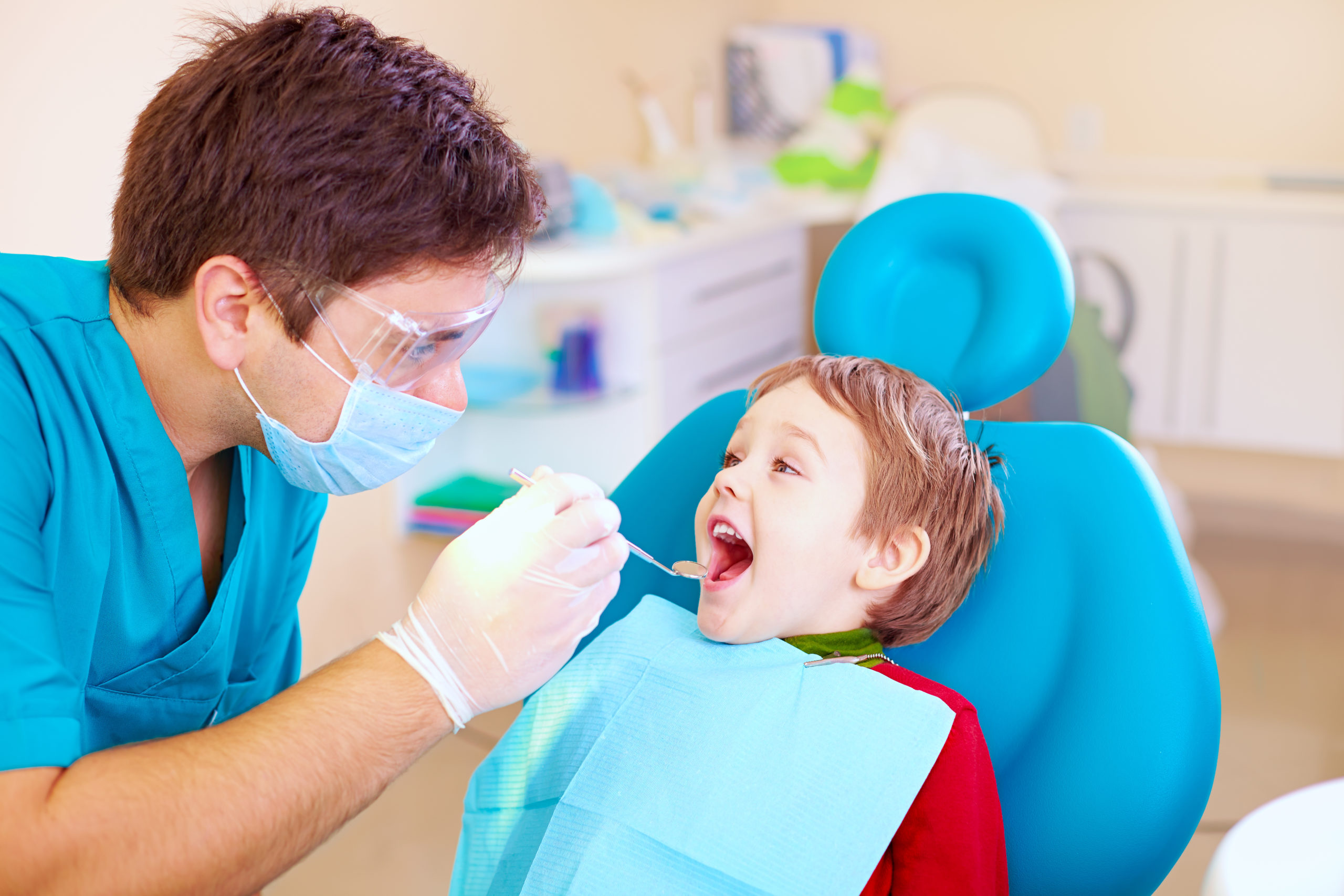 south calgary dentist giving a dental exam to a child 